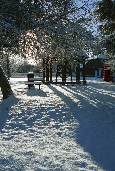 The old village well photographed with the sun behind it